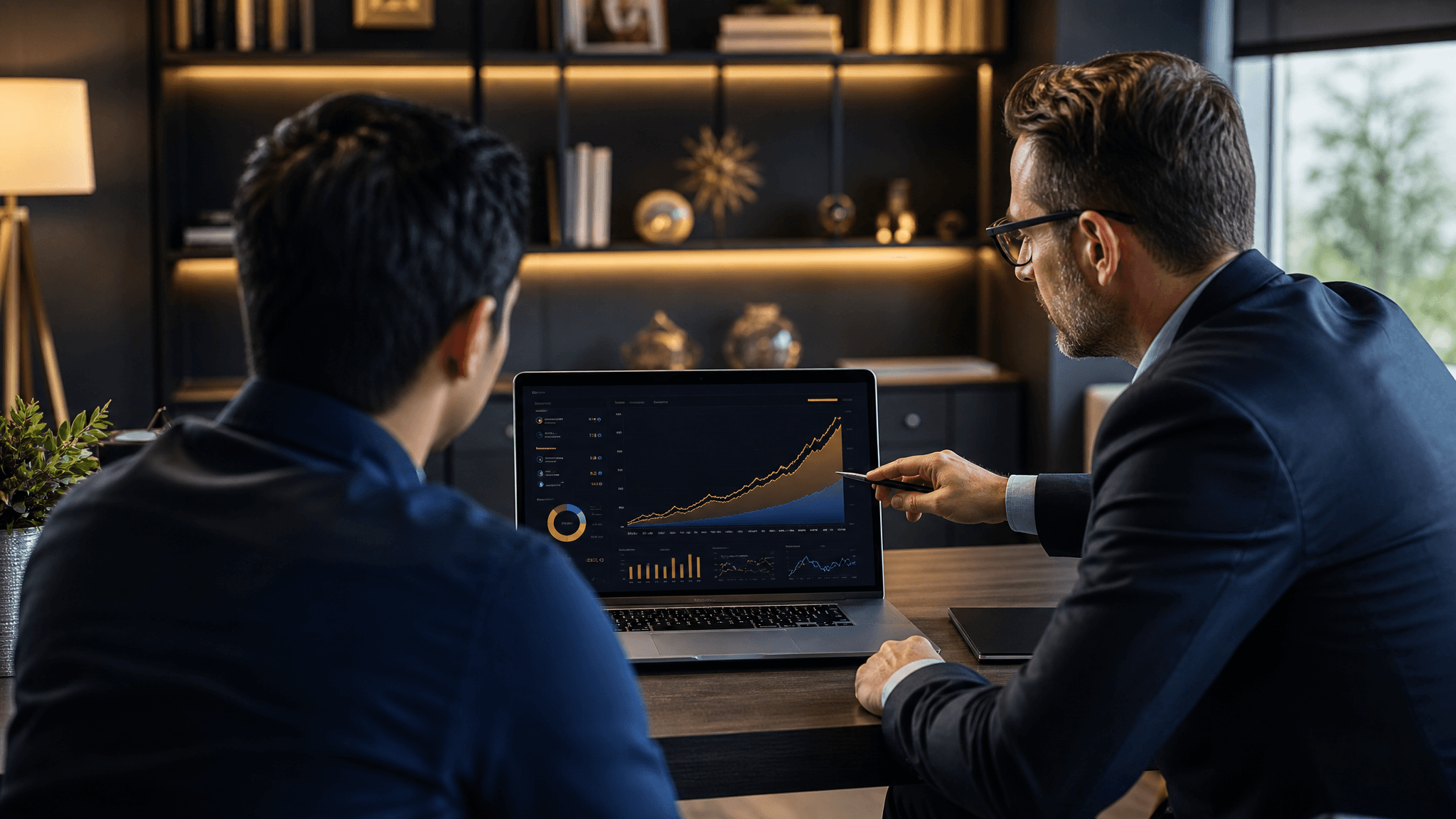 A young professional reviews a Roth IRA projection on a laptop with a financial advisor