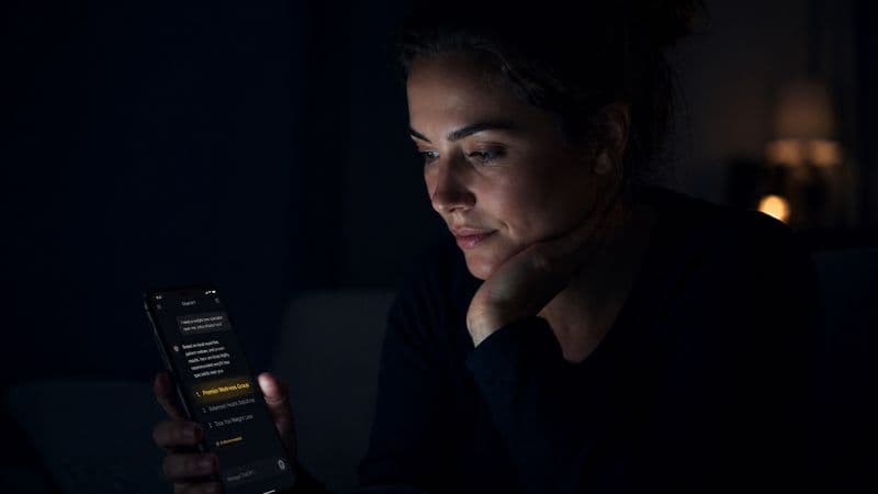 A patient privately researching healthcare providers on their phone at night